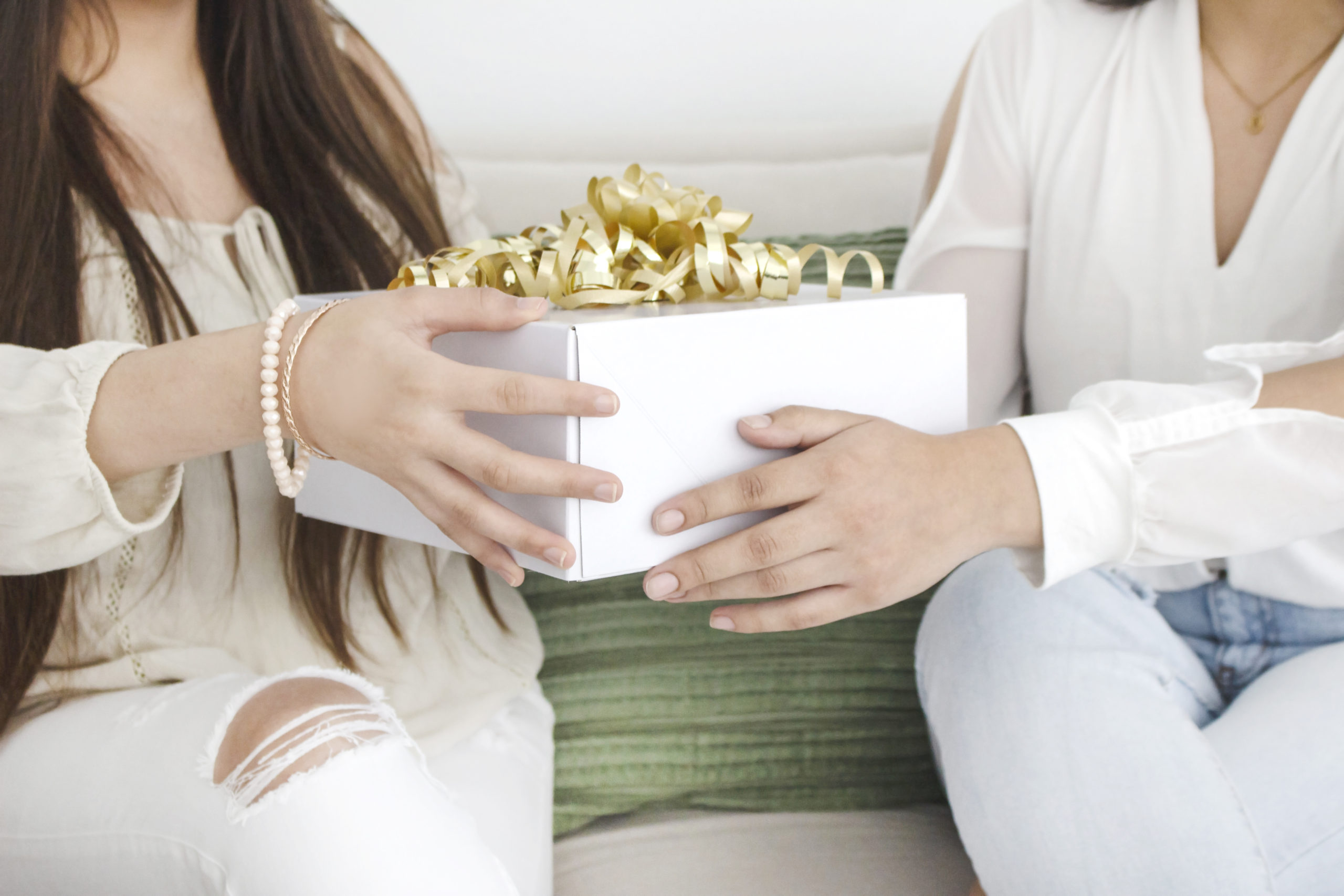 a-woman-gifting-her-friend-a-white-box-of-gift