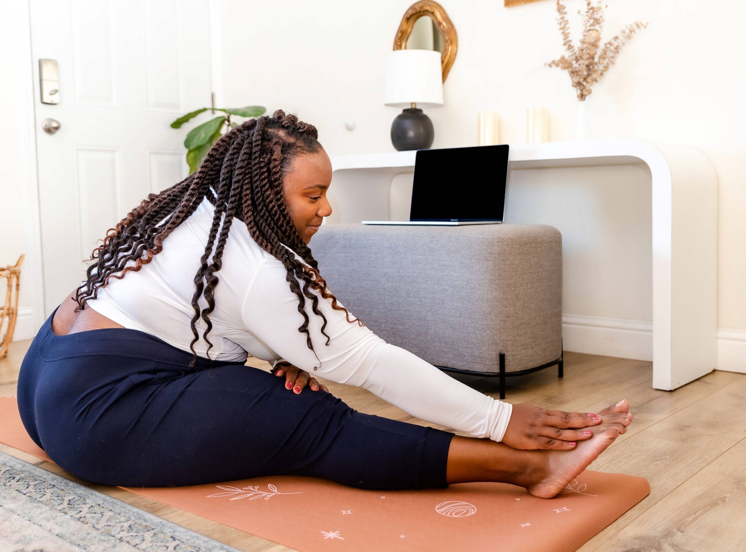 black-plus-size-lady-stretching-on-the-floor