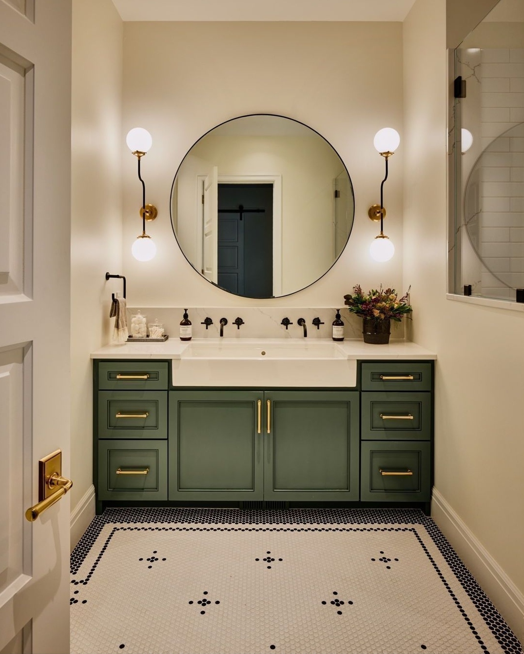 green-bathroom-vanity-in-a-white-bathroom-with-mirror-above