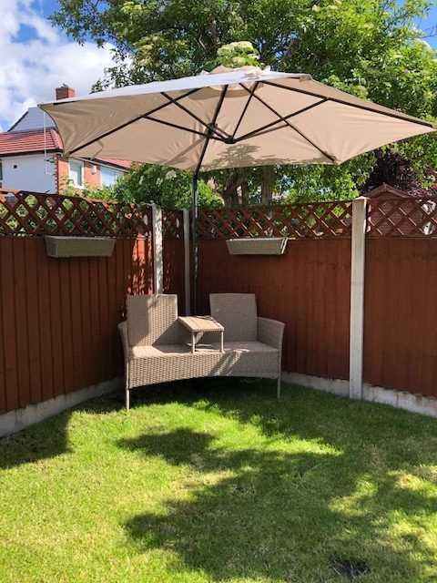 Outdoor umbrella for small budget patio space design