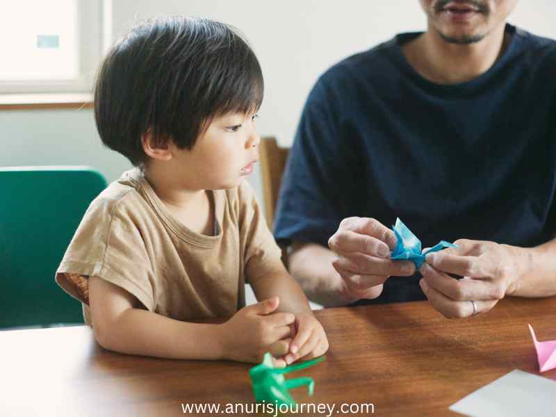 Father-and-son-making-a-paper-craft-as-37-Fun-and-Creative-Fathers-Day-Crafts-for-Kids-to-Make