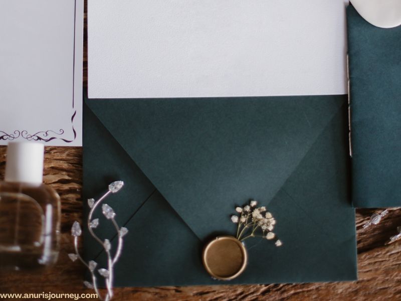 a white and navy blue wedding invitation