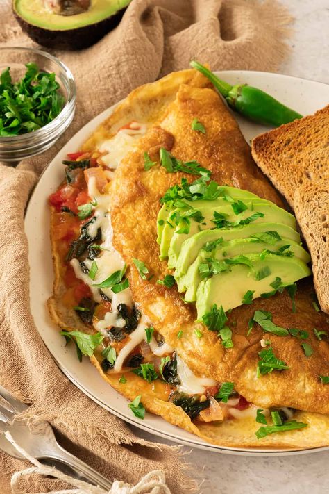 Omelette-with-Her-Favorite-Toppings.-as-23-Mothers-Day-Breakfast-in-Bed-Ideas-That-Will-Make-Her-Feel-Like-a-Queen.