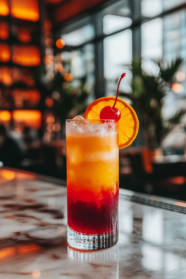 Tropical-Tequila-Sunrise.-as-31-Must-Try-4th-of-July-Drink-Recipes-Both-Alcoholic-Non-Alcoholic.