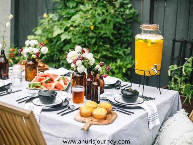 A-tablescape-that-has-a-lot of-food-varieties-and-a-juice-jar-as-23-Stylish-Fathers-Day-Tablescape-Ideas-for-a-Classy-Celebration