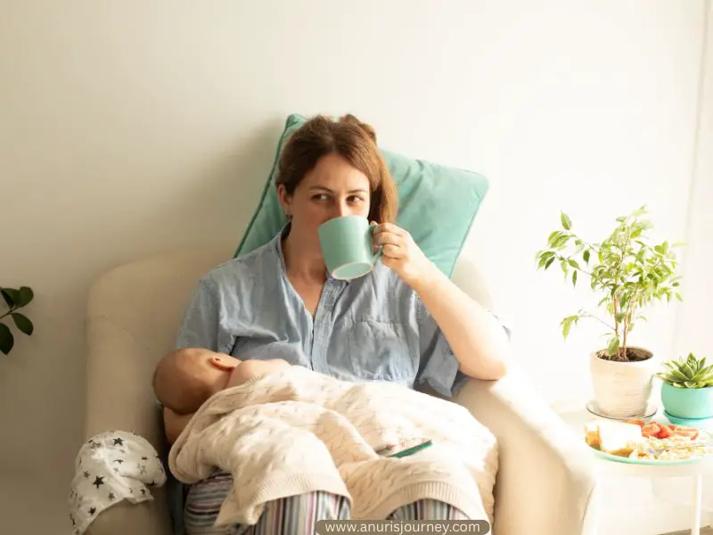 mother-taking-a-cup-of-coffee-while-breastfeeding