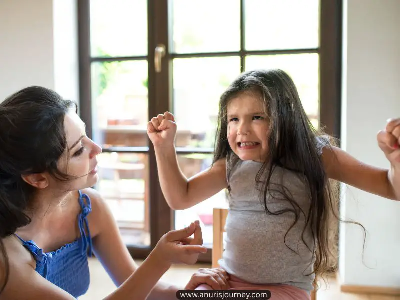 toddler-flinching-her-fist-How-to-Stop-Your-Toddler-from-Hitting-Without-Harsh-Punishments