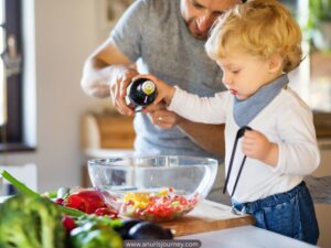 Toddler-helping-in-the-kitchen-How-to-Get-Your-Toddler-to-Eat-Vegetables-Without-a-Fight