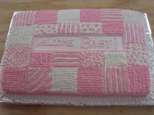 this is a Patchwork Quilt Cake for a baby shower