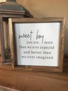 this is a framed Quotes and Sayings for a baby shower