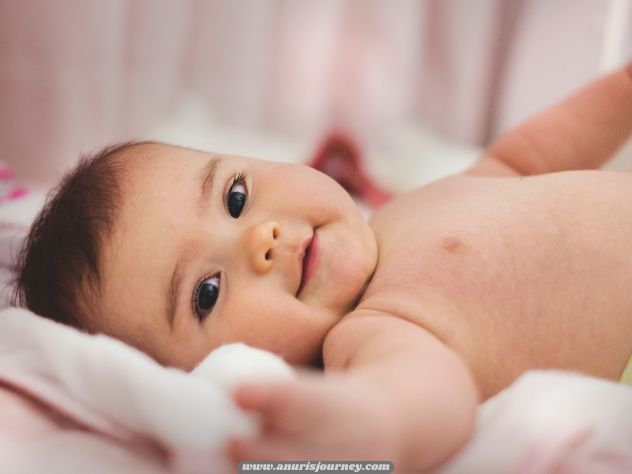 A-baby-smiling-as-one-of-How-to-Get-your-Baby-on-a-Schedule-even-when-you-have-no-routine-yet 