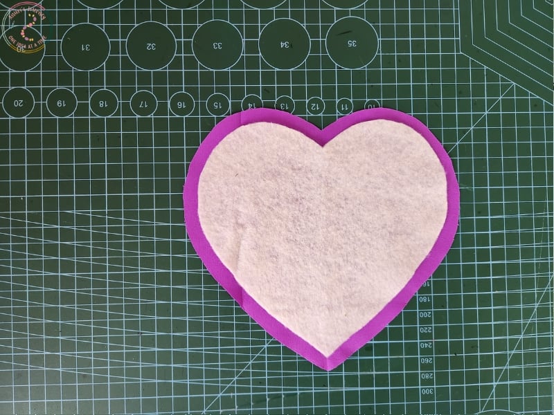 attach-the-padding-heart-shaped-fabric-coaster
