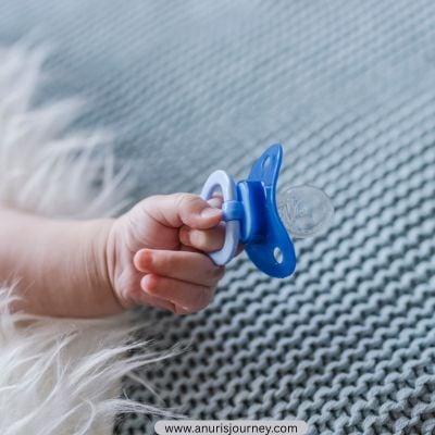 baby-holding-a-pacifier--how-to-wean-a-toddler-off-pacifiers-without-meltdowns