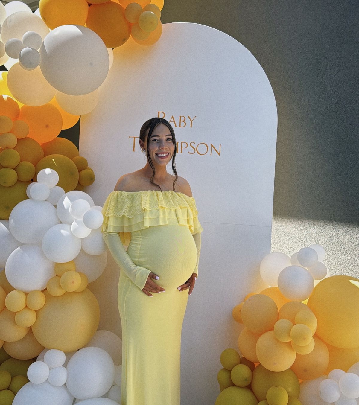 Winnie the Pooh baby shower outfit inspiration for mom-to-be
