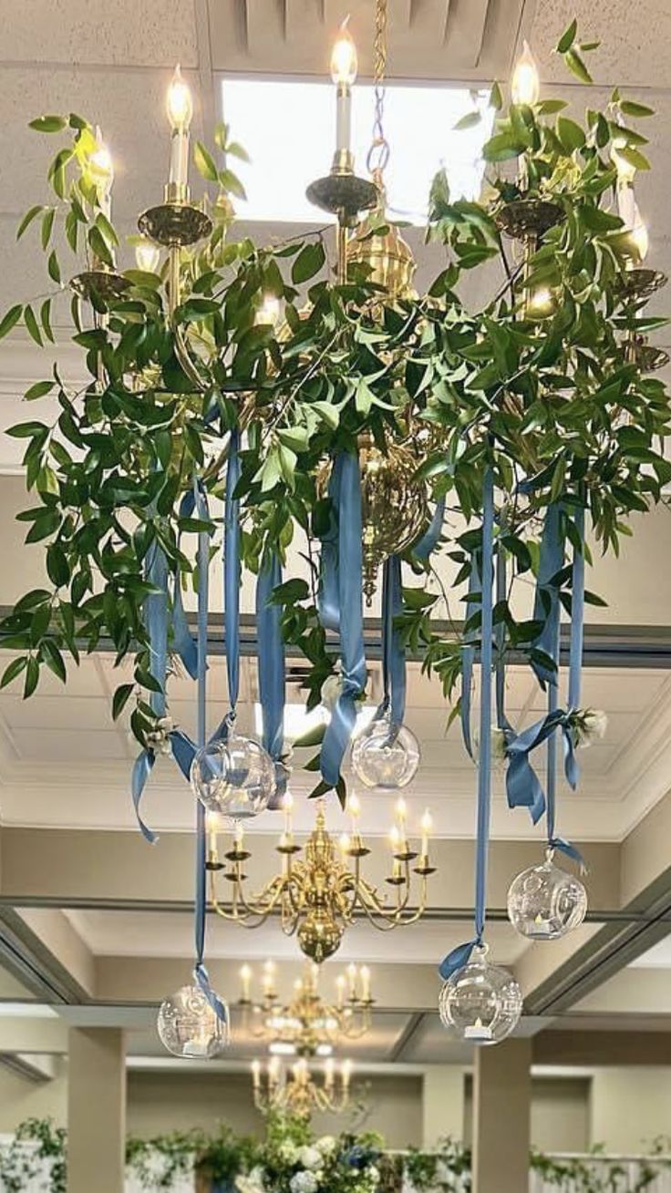 Chandelier-Draped-With-Greenery-and-Flowers