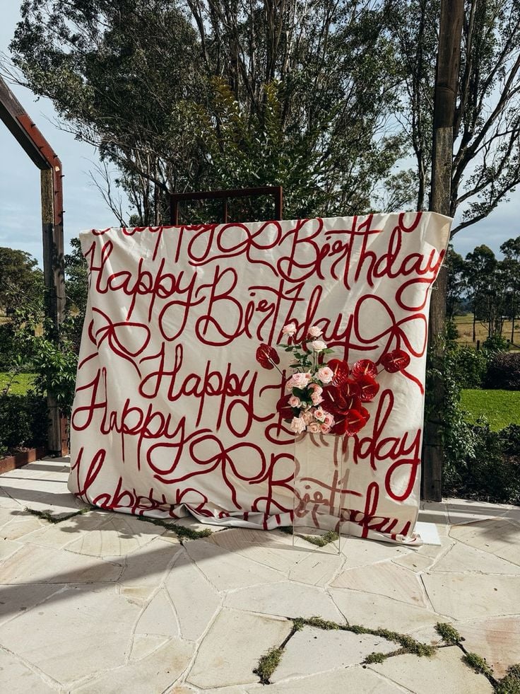 Painted-Drop-Cloth-Backdrop-DIY-Birthday-Decorations-for-Adults